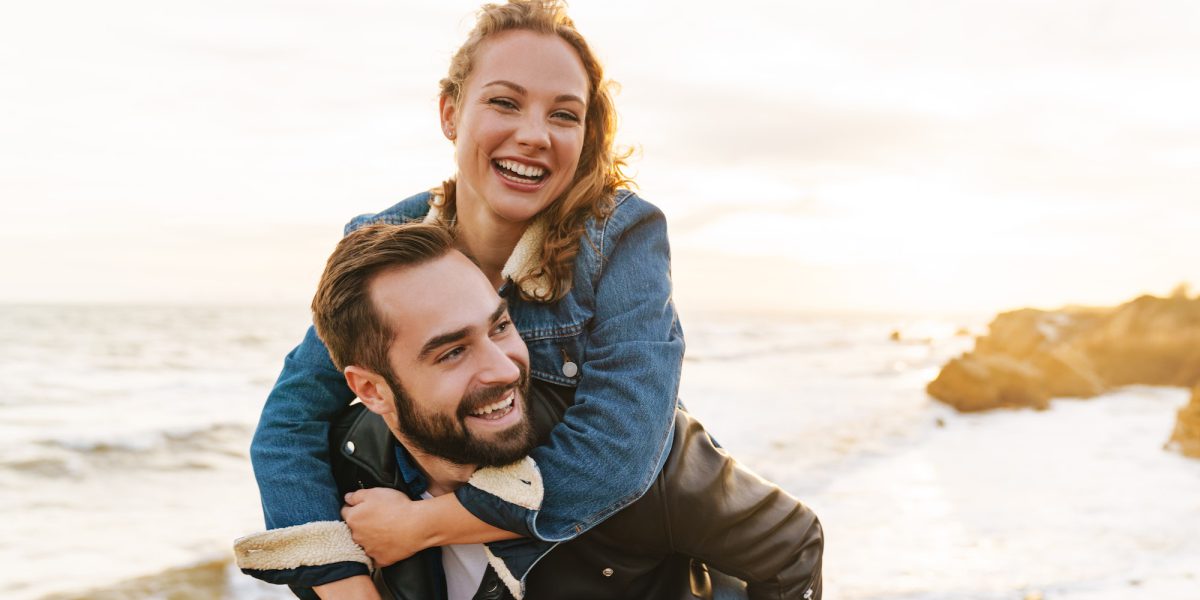 image-of-beautiful-young-couple-piggybacking-while-walking-by-seaside.jpg image-of-beautiful-young-couple-piggybacking-while-walking-by-seaside.jpg